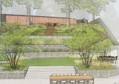 Looking over the dining terrace and lawn in this garden design in Northamptonshire.